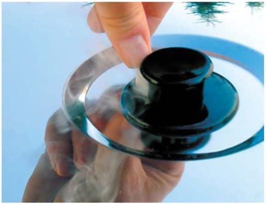 Hand adjusting the smoke vent on the lid of the Behr ECOplus Smoker