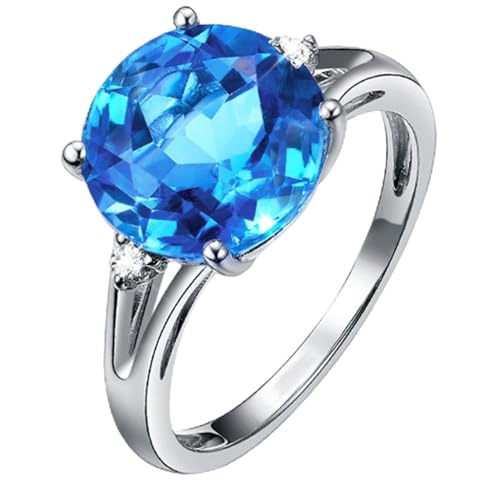 Bague en or blanc 14 carats sertie d'une topaze bleu suisse et diamants