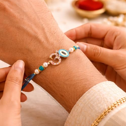 Image of JAIPUR ACE Om Evil Eye Rakhi for Brother | Premium Blue Thread Designer Rakhi Bracelet with Beads | Raksha Bandhan Gift Set with Roli Chawal & Greeting Card | Spiritual Rakhi Gift