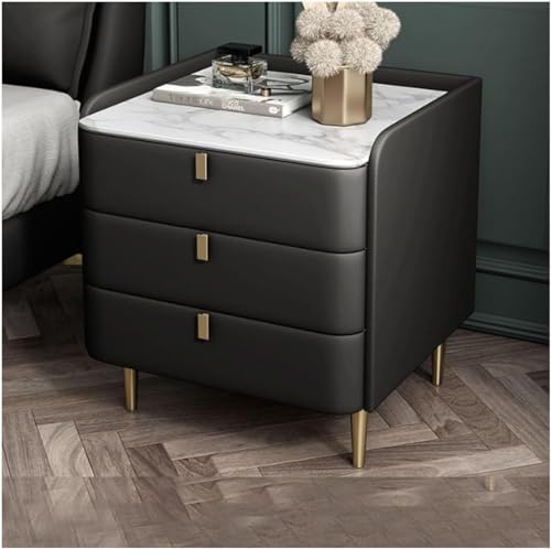 Migliora l'arredamento della tua camera da letto con il nostro lussuoso comodino. Questo elegante comodino presenta un piano in ardesia che ne esalta il fascino estetico. La pelle in microfibra resistente ai graffi aggiunge durata, mentre le gambe in metallo stabili garantiscono affidabilità. Progettato con un treppiede ispessito, offre proprietà antiscivolo e resistenti all'usura per la massima stabilità. Perfetto per qualsiasi camera da letto moderna.