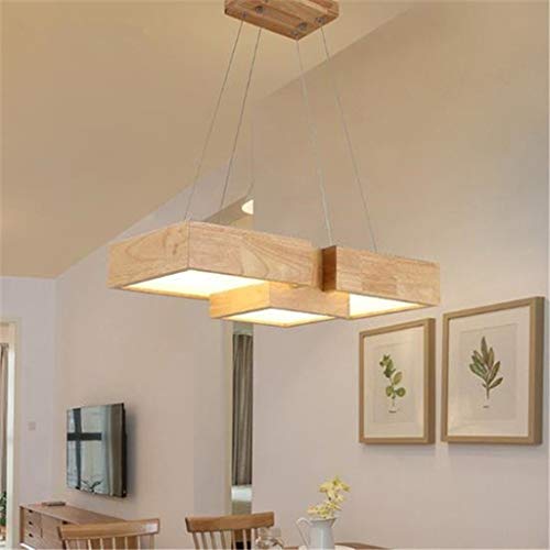Table de dîner lumineuse avec la lampe suspendue en bois led