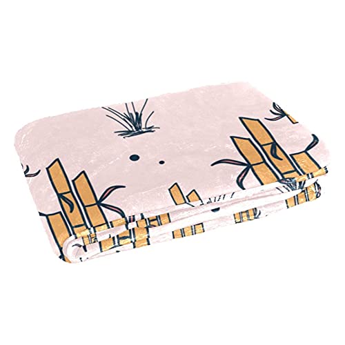 Couverture douce motif bambou : votre alliée pique-nique et camping