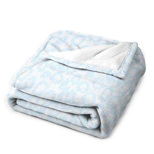 Couverture douce pelucheuse léopard bleu contre le froid du canapé