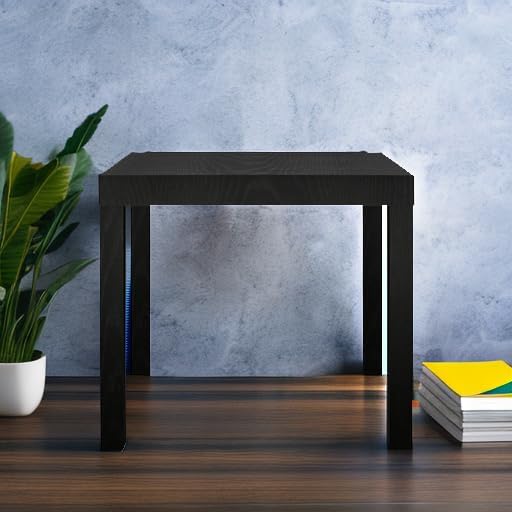 Ameriwood Home Parsons Black End Table in a room with a plant and books