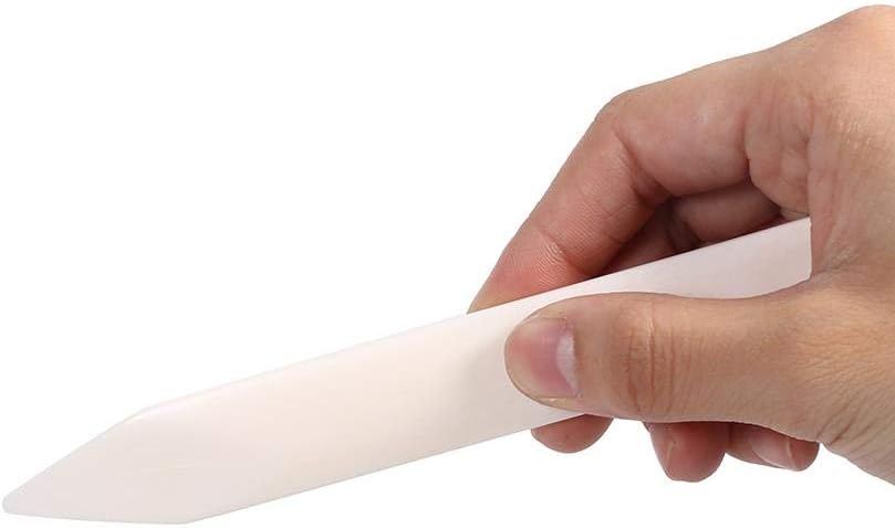 Another view of hand holding the MAGT Leather Craft Bone Tool