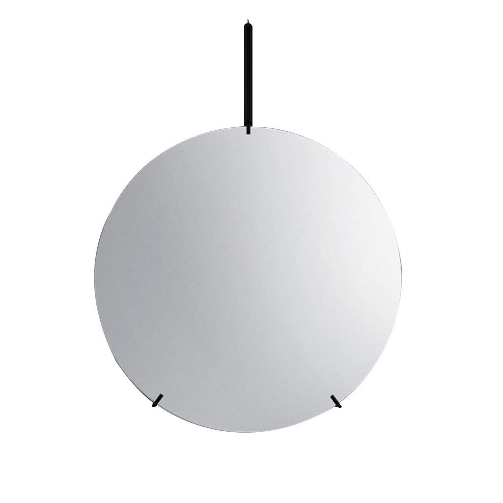 Miroir circulaire doré suspendu idéal pour illuminer la salle de bain