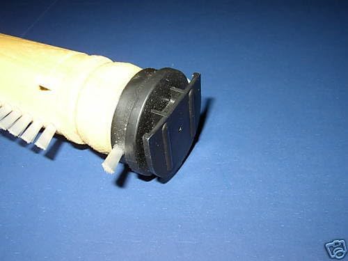 Angled view of the brush roll's U-shaped end cap