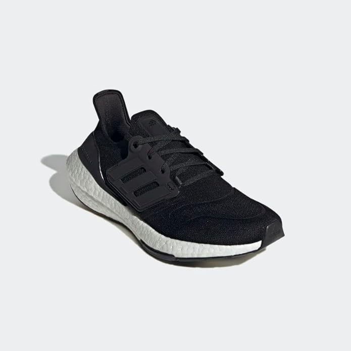 A side view of an Adidas Ultraboost 22 running shoe in black, featuring a cushioned BOOST midsole and breathable upper, displayed against a plain background.