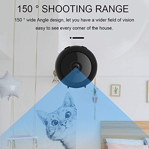 DINGXUEMEI DXM Security Camera A11 mounted on a desk using its magnetic bracket, overlooking a computer setup