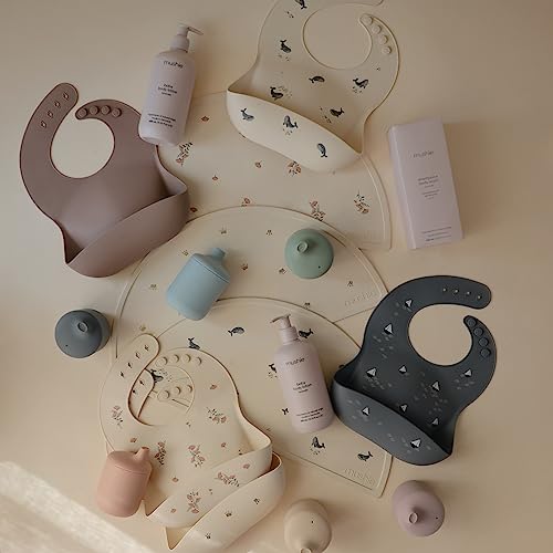 Image of mushie Silicone Baby Bib | Adjustable Fit Waterproof Bibs (Pink Flowers)
