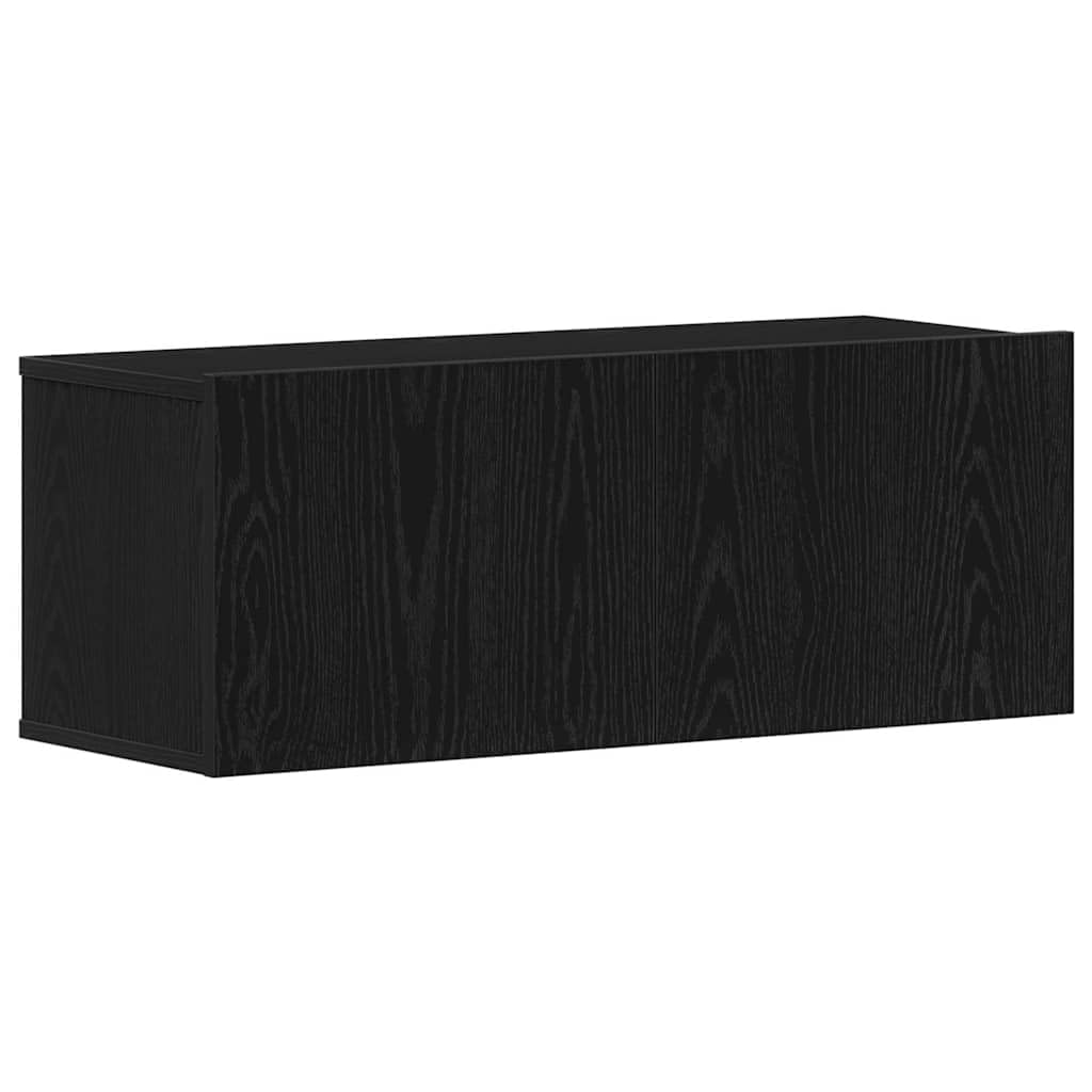 Meuble TV noir aspect chêne pour ranger les câbles dans un petit salon