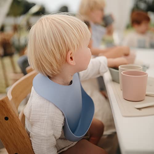 Image of mushie Silicone Baby Bib | Adjustable Fit Waterproof Bibs (Powder Blue)