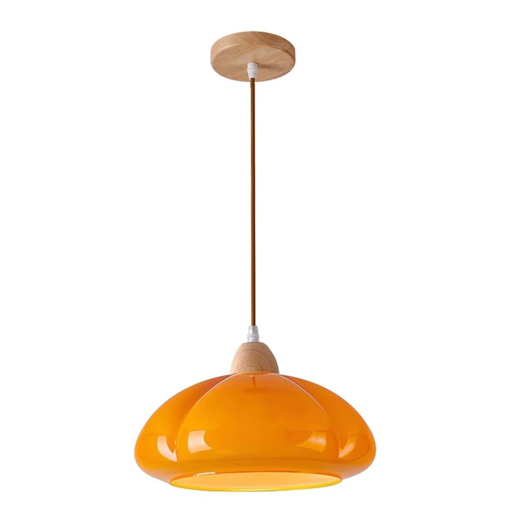 Lámpara de cristal naranja tipo calabaza para crear un comedor cálido y moderno