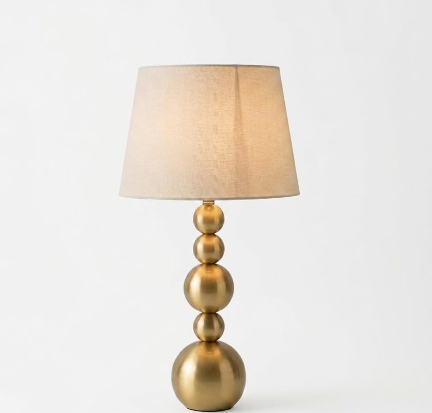 Image of Gold Metal Ball Table Lamp with Neutral Linen Shade - 5-Tier Spherical Base Design - Premium Brass Finish Accent Light for Modern Home Interiors & Bedside Tables