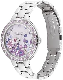 Close-up of the COACH Chelsea watch face showing the delicate floral design.