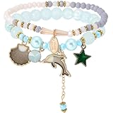 Bracelet Dauphin Bleu:Ce bracelet en verre océanique est composé de bracelets empilables ornés de verre et d'émail d'alliage., et est livré avec des cordons élastiques. Les couleurs éclatantes sont associées à des breloques amusantes sur le thème de l'océan., y compris les étoiles de mer, coquilles, et les dauphins, ce qui en fait l'accessoire parfait pour un thème océanique estival