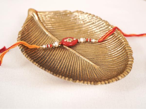 Image of BEHOMA Metal Leaf Shape Tray for Home Decor, Medium, Golden | Golden leaf-shape metal tray, medium size; perfect for mandap, haldi, mehendi & Navratri decor.