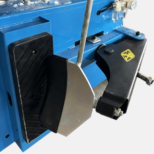 Close-up of the adjustable clamps on the KATOOL tire changer