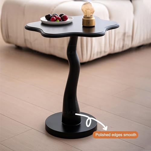 Petite table d'appoint noire compacte pour optimiser l'espace près du canapé
