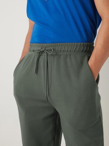 Image of Bewakoof Men's Cotton Regular Fit Joggers|Bewakoof Heavy Duty 1.0 | Track pants for man | Lower for man | Trouser for men | Multipurpose | Mens Lower Activewear | Utility Pockets | Lightweight & Flexible Elastic Waist | Casual Joggers