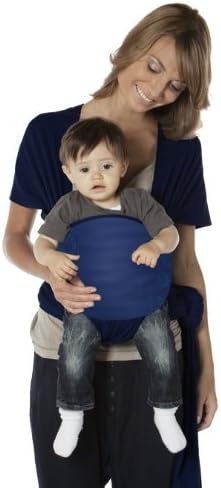 Parent with baby in a front-carry, outward-facing position using the CYBEX u.GO carrier.