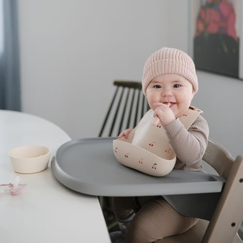 Image of mushie Silicone Baby Bib | Adjustable Fit Waterproof Bibs (Cherries)