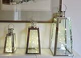 Conjunto de 3 faroles de metal plateado con luces.