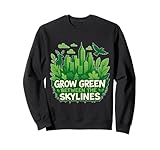 Mostra il tuo stile eco-consapevole con questa maglietta grafica Grow Green Between the Skylines. Caratterizzato da un'audace citazione in stile graffiti stratificata su un paesaggio urbano unico e una fusione forestale, questo design fonde perfettamente l'estetica della street art urbana.