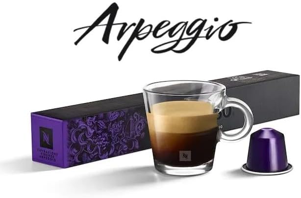 Two Nespresso Descaling Agent sachets, showing product information and safety warnings.