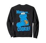 Design audacieux Sesame Street Cookie Monster avec slogan MMMmm Cookie, illustration rétro bleu moucheté et miettes volantes, produit idéal pour les enfants, les parents, les fans de collation, les joueurs de collectionneurs, les équipes de café, les étudiants, les journées de parc à thème et au quotidien