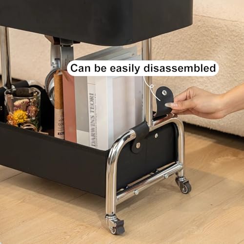 Table d'appoint moderne noire à roulettes pour optimiser les petits salons