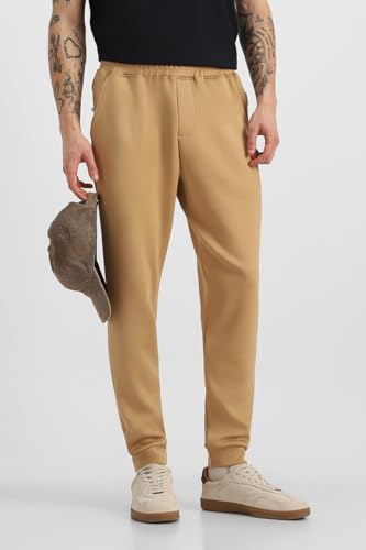 Image of SNITCH Men Track Pants | Relaxed Fit with Contrast Side Stripes & Zippered Pockets | Polyester Blend Fabric for Athletic & Street Wear | Stretchable & Comfortable Design