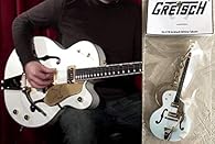 Creative cute guitar keychain of modern style Measures: 3.5 x 1.2 x 0.13 inches Material: made in acrylic and lacquered - Very Light Weightt!!! Weight: 7 grames / 0.3 ounces Be a rock star wherever you go with this mini guitar keychain