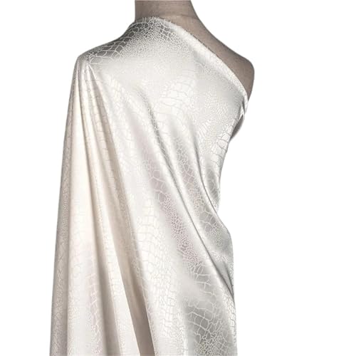 Tissu jacquard blanc micro stretch pour coudre une robe de cocktail élégante
