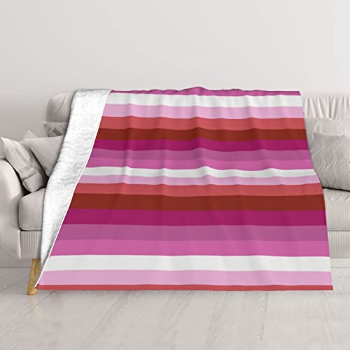 Couverture arc-en-ciel en peluche pour cocooning sur le canapé