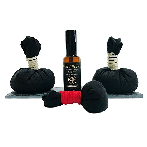 Botella de 50 ml de Aceite May Chang con Ylang Ylang sobre una bandeja y pindas Cover