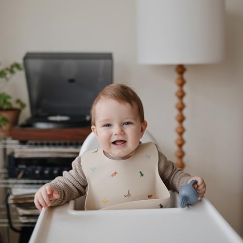 Image of mushie Silicone Baby Bib | Adjustable Fit Waterproof Bibs (Dinosaurs)