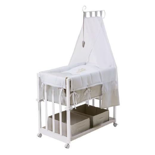 Cuna de colecho roba 4 en 1, con vestiduras 'Heartbreaker', utilizable como cuna de colecho, cuna balancin, cuna normal y banco para niños, fabricada en madera lacada en blanco y con vestiduras completas, y ropa de cuna de (80x80cm)