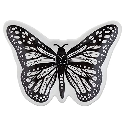 a small butterfly-shaped trinket dish holding a ring and an earring