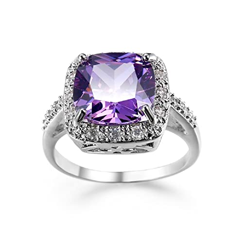 Bague en argent avec pierres violettes coupe ronde et diamants