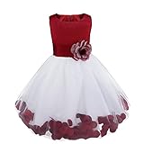 Der Rock von dem Mädchenkleid mit Blütenblätter, Tailleband mit abnehmbarer Brosche am Rücken.