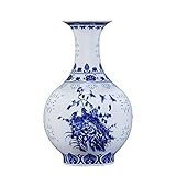FEATURES: Die blaue und weiße Porzellan-Vase Modellierung klassisch, mit chinesischen Drachen Mustern und binauralen Drachen, glatt und zart texture.Ceramic Vasen sind oft verziert, und sie sind oft zu halten, schneiden verwendet flowers.It auch Sammlerwert hat.