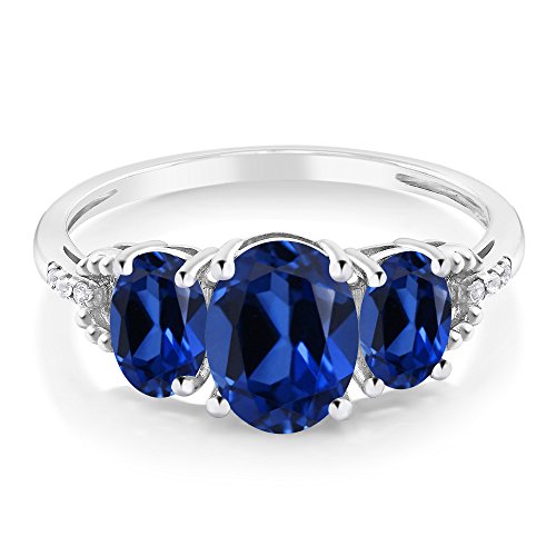 Gem Stone King 10K White Gold Oval Blue Created Sapphire and Diamond Accent 3-Stone Engagement Ring For Women | 2.65 Cttw | Gemstone Birthstone | Available In Size 5-9.53