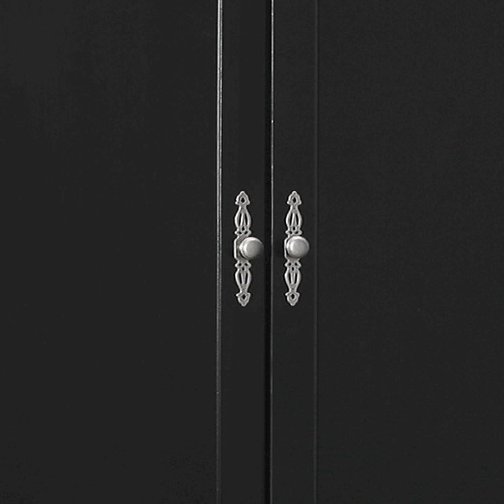 Close-up view of the decorative handles on the doors of the Glory Furniture Louis Phillipe Armoire