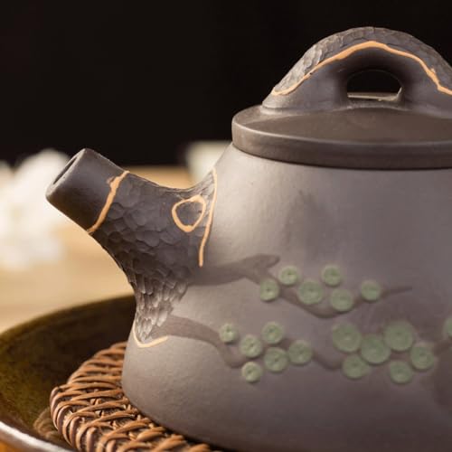 Kettle pot traditionnel en céramique d'art avec infuseur de thé