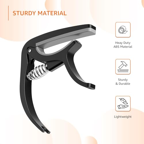 Image of Amazon Basics Guitar Capo with Pin Remover | Heavy Duty ABS Material | Versatile Fit | For Acoustic & Electric Guitar, Ukulele and Banjo | Buzz Free (Black)