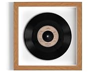 This is the genuine 7" record, raised within the frame, giving a fantastic 3D 'floating' effect. This is surrounded by either plain white cartridge paper or sheet music and a black, white or oak-effect frame, with a clear plastic glass front. Please ...