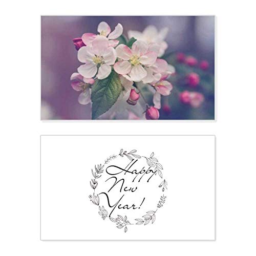 Tarjeta de felicitación de Año Nuevo con flores blancas postales