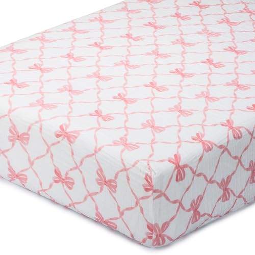 Image of LollyBanks Muslin Crib Sheet, 100% Cotton Fitted Crib Sheets for Girls | Smooth breathable fabric, full-perimeter elastic for a tidy fit on 52 x 28 in standard mattresses (Pink Bow)