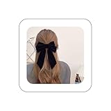 Barrette à cheveux avec nœud en ruban noir mettant parfaitement en valeur la beauté des filles.